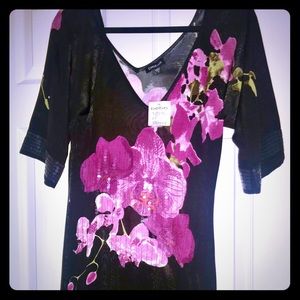 Black deep V neck- open shoulder top with Orchids.